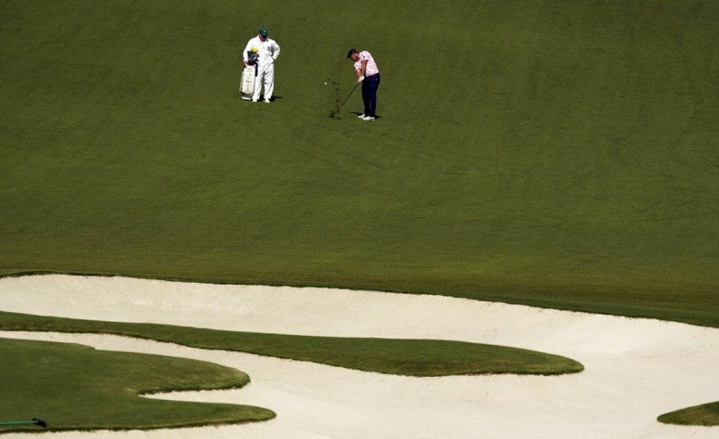 Nov 14, 2020; Augusta, Georgia, USA; Bryson DeChambeau plays his shot from the tenth fairway during the third round of The Masters golf tournament at Augusta National GC. Mandatory Credit: Rob Schumacher-USA TODAY Sports
