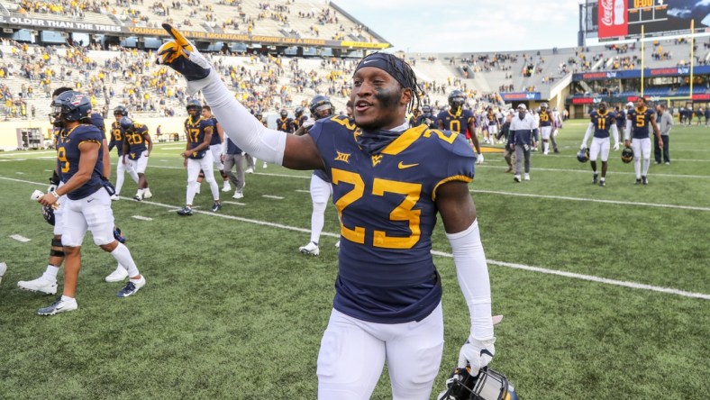 Nov 14, 2020; Morgantown, West Virginia, USA; West Virginia Mountaineers safety Tykee Smith (23) celebrates after defeating the TCU Horned Frogs at Mountaineer Field at Milan Puskar Stadium. Mandatory Credit: Ben Queen-USA TODAY Sports