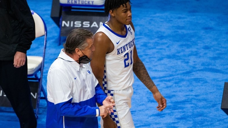 Nov 29, 2020; Lexington, Kentucky, USA; Kentucky Wildcats head coach John Calipari talks with forward Cam'ron Fletcher (21) in the first half against the Richmond Spiders at Rupp Arena at Central Bank Center. Mandatory Credit: Jordan Prather-USA TODAY Sports