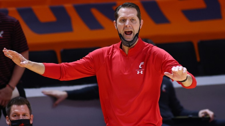 Dec 12, 2020; Knoxville, Tennessee, USA; Cincinnati Bearcats head coach John Brannen reacts during the first half against the Tennessee Volunteers at Thompson-Boling Arena. Mandatory Credit: Randy Sartin-USA TODAY Sports