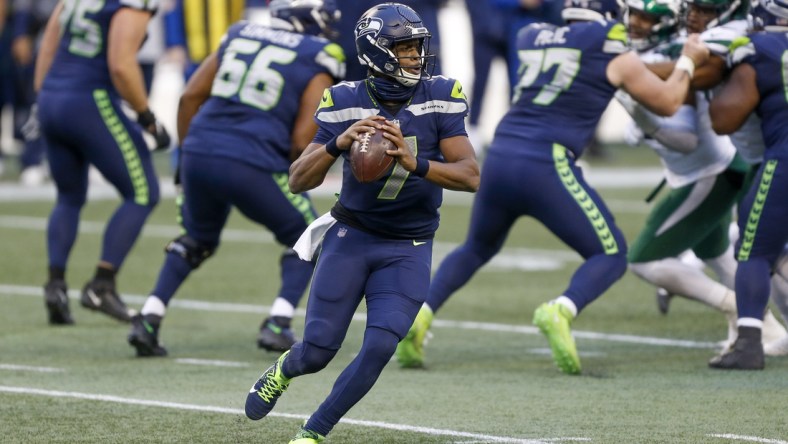 Dec 13, 2020; Seattle, Washington, USA; Seattle Seahawks quarterback Geno Smith (7) passes against the New York Jets during the fourth quarter at Lumen Field. Mandatory Credit: Joe Nicholson-USA TODAY Sports