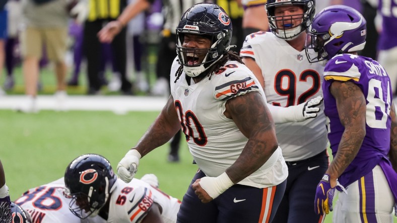 Dec 20, 2020; Minneapolis, Minnesota, USA; Chicago Bears defensive lineman John Jenkins (90) celebrates a tackle in the second quarter against the Minnesota Vikings at U.S. Bank Stadium. Mandatory Credit: Brad Rempel-USA TODAY Sports