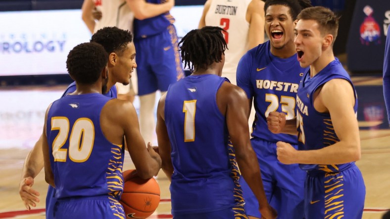 Dec 22, 2020; Richmond, Virginia, USA; Hofstra Pride players celebrate on the court after their game against the Richmond Spiders at Robins Center. Mandatory Credit: Geoff Burke-USA TODAY Sports