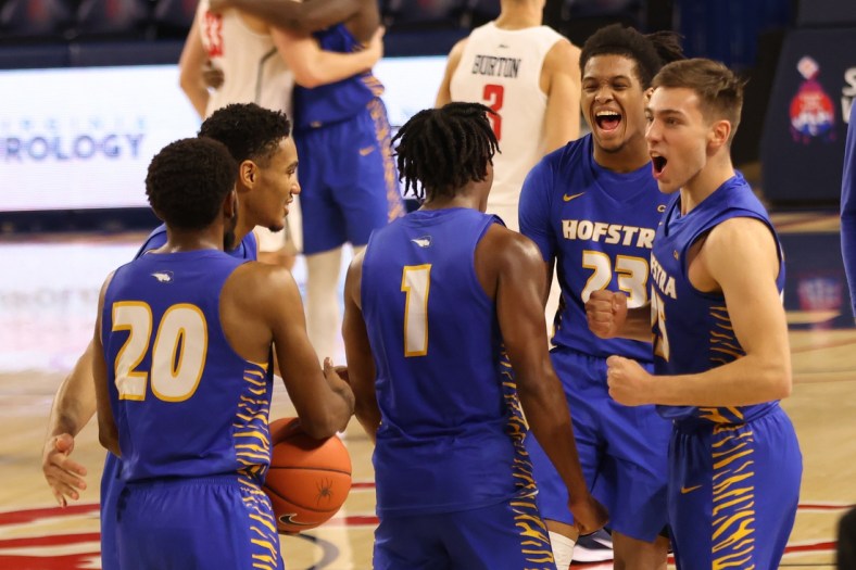 Dec 22, 2020; Richmond, Virginia, USA; Hofstra Pride players celebrate on the court after their game against the Richmond Spiders at Robins Center. Mandatory Credit: Geoff Burke-USA TODAY Sports