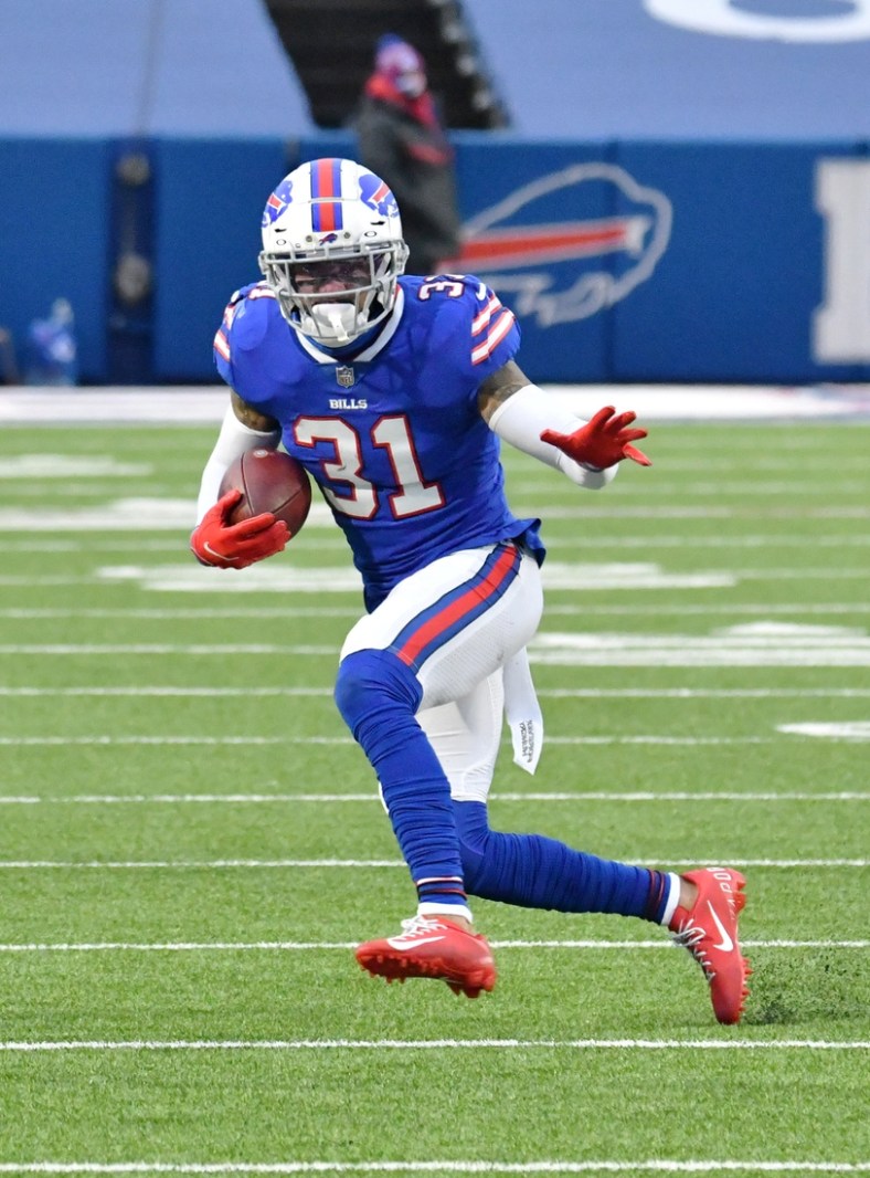 Jan 3, 2021; Orchard Park, New York, USA; Buffalo Bills strong safety Dean Marlowe (31) returns an interception against the Miami Dolphins in the fourth quarter at Bills Stadium. Mandatory Credit: Mark Konezny-USA TODAY Sports