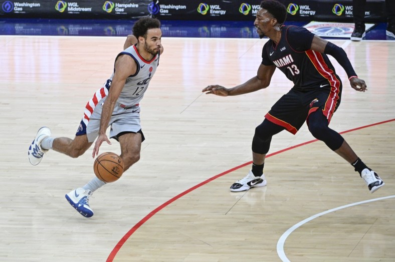 Jan 9, 2021; Washington, District of Columbia, USA;  Washington Wizards guard Jerome Robinson (12) makes  move to the basket as Miami Heat center Bam Adebayo (13) defends during the second half at Capital One Arena. Mandatory Credit: Tommy Gilligan-USA TODAY Sports