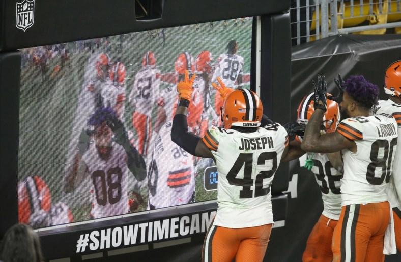 Jan 10, 2021; Pittsburgh, Pennsylvania, USA;  Cleveland Browns players including strong safety Karl Joseph (42) and wide receiver Jarvis Landry (80) celebrate at the showtime camera against the Pittsburgh Steelers during the fourth quarter at Heinz Field. The Browns won 48-37. Mandatory Credit: Charles LeClaire-USA TODAY Sports