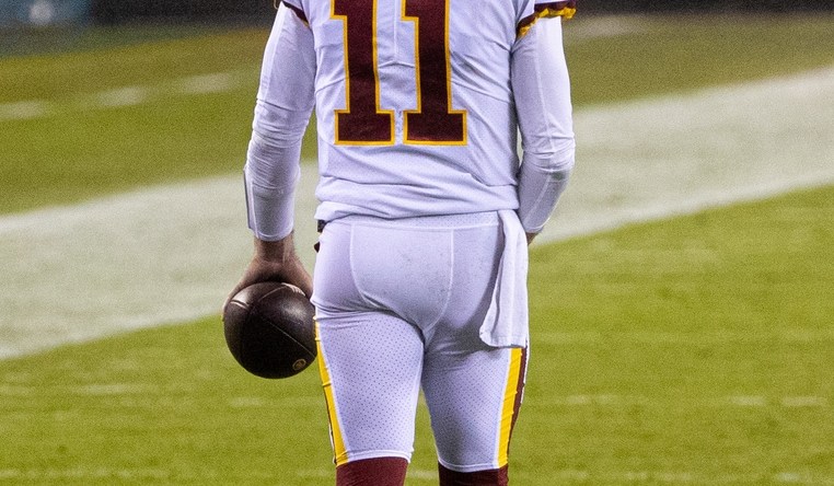 Jan 3, 2021; Philadelphia, Pennsylvania, USA; Washington Football Team quarterback Alex Smith (11) walks up the field at the end of the third quarter against the Philadelphia Eagles at Lincoln Financial Field. Mandatory Credit: Bill Streicher-USA TODAY Sports