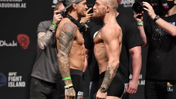 Jan 22, 2021; Abu Dhabi, UNITED ARAB EMIRATES;   Dustin Poirier and Conor McGregor of Ireland face off during the UFC 257 weigh-in at Etihad Arena on UFC Fight Island on January 22, 2021 in Abu Dhabi, United Arab Emirates. Mandatory Credit: Jeff Bottari/Handout Photo via USA TODAY Sports