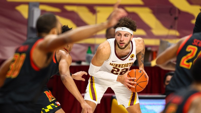 Jan 23, 2021; Minneapolis, Minnesota, USA; Minnesota Gophers guard Gabe Kalscheur (22) looks to passes the ball during the second half against the Maryland Terrapins at Williams Arena. Mandatory Credit: Harrison Barden-USA TODAY Sports