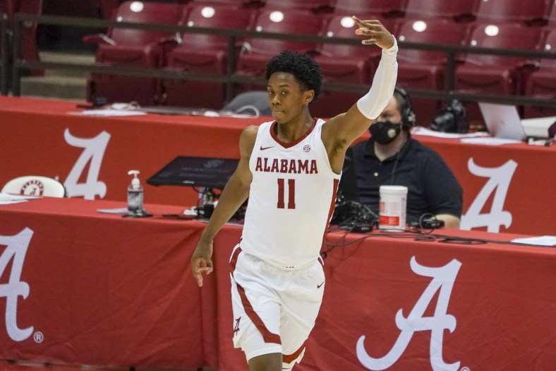 Jan 23, 2021; Tuscaloosa, Alabama, USA; Alabama Crimson Tide guard Joshua Primo (11) reacts after making a three point basket against the Mississippi State Bulldogs during the first half at Coleman Coliseum. Mandatory Credit: Marvin Gentry-USA TODAY Sports