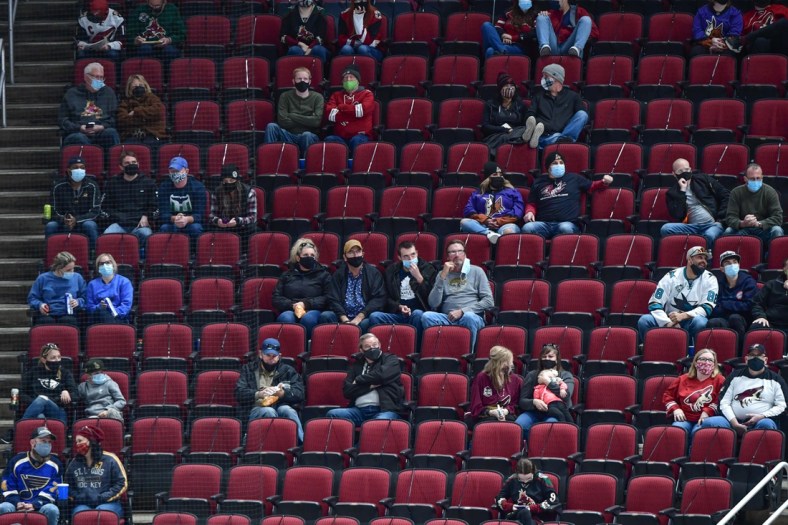 Feb 15, 2021; Glendale, Arizona, USA;  Fans look on during the third period of the game between the Arizona Coyotes and the St. Louis Blues at Gila River Arena. Mandatory Credit: Matt Kartozian-USA TODAY Sports