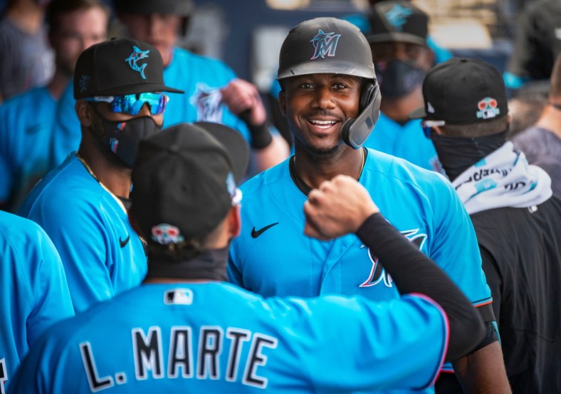 Marlins Lewis Brinson celebrates his home run during the first spring training game of the year between the Miami Marlins and the Houston Astros at The Ballpark of the Palm Beaches West Palm Beach, Florida on February 28, 2021.