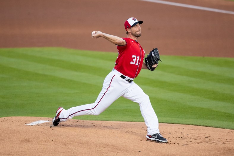 Mar 5, 2021; West Palm Beach, Florida, USA; Washington Nationals starting pitcher Max Scherzer (31) delivers a pitch against the St. Louis Cardinals during the first inning of a spring training game at FITTEAM Ballpark of the Palm Beaches. Mandatory Credit: Mary Holt-USA TODAY Sports