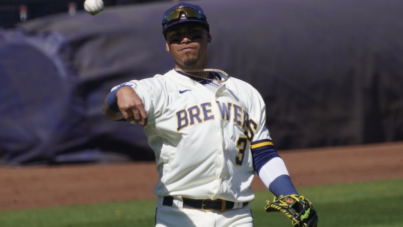 Mar 6, 2021; Phoenix, Arizona, USA; Milwaukee Brewers shortstop Orlando Arcia (3) warms up before a spring training game against the Chicago Cubs at American Family Fields of Phoenix. Mandatory Credit: Rick Scuteri-USA TODAY Sports