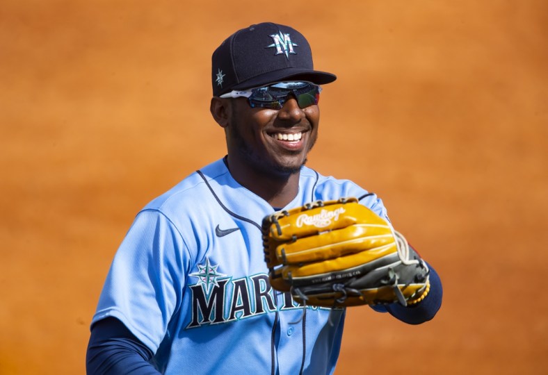 Mar 7, 2021; Tempe, Arizona, USA; Seattle Mariners outfielder Kyle Lewis reacts as he celebrates robbing a home run against the Los Angeles Angels during a Spring Training game at Tempe Diablo Stadium. Mandatory Credit: Mark J. Rebilas-USA TODAY Sports