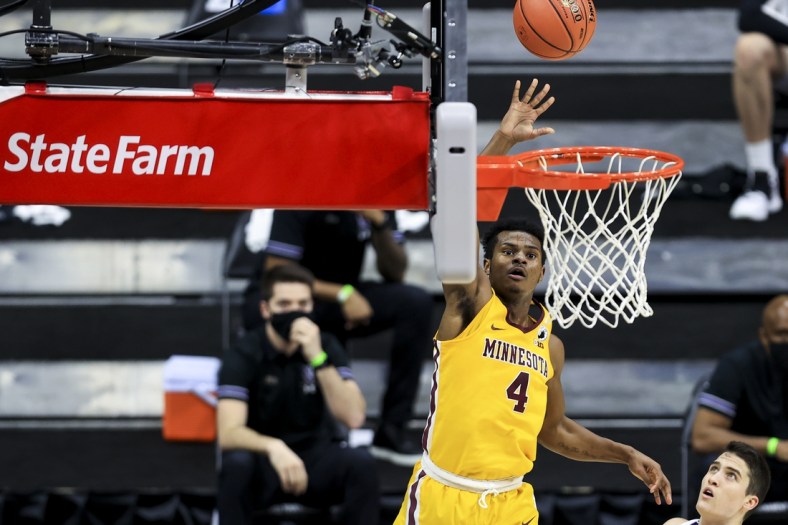 Mar 10, 2021; Indianapolis, Indiana, USA; Minnesota Golden Gophers guard Jamal Mashburn Jr. (4) drives to the basket against the Northwestern Wildcats in the first half at Lucas Oil Stadium. Mandatory Credit: Aaron Doster-USA TODAY Sports