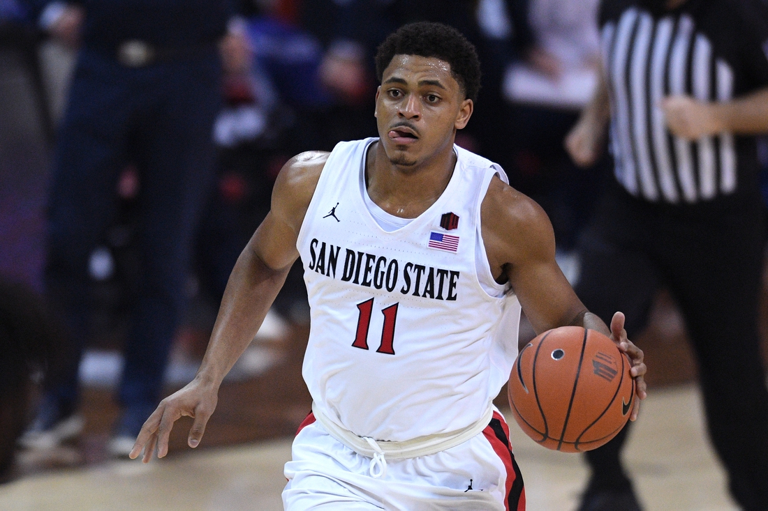 Mar 13, 2021; Las Vegas, Nevada, USA; San Diego State Aztecs forward Matt Mitchell (11) dribbles the ball against the Utah State Aggies during the second half at the Thomas & Mack Center. Mandatory Credit: Orlando Ramirez-USA TODAY Sports