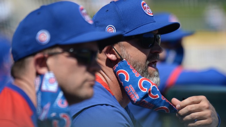 Mar 18, 2021; Goodyear, Arizona, USA; Chicago Cubs manager David Ross looks on against the Cleveland Indians during the first inning of a spring training game at Goodyear Ballpark. Mandatory Credit: Joe Camporeale-USA TODAY Sports