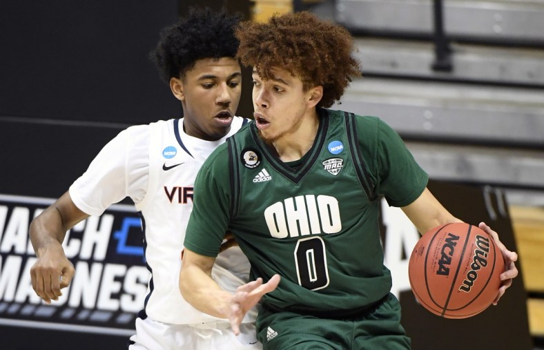 Ohio Bobcats guard Jason Preston (0) looks for a shot guarded by Virginia Cavaliers guard Reece Beekman (2)  during the first round of the 2021 NCAA Tournament on Saturday, March 20, 2021, at Simon Skjodt Assembly Hall in Bloomington, Ind. Mandatory Credit: Rich Janzaruk/IndyStar via USA TODAY Sports