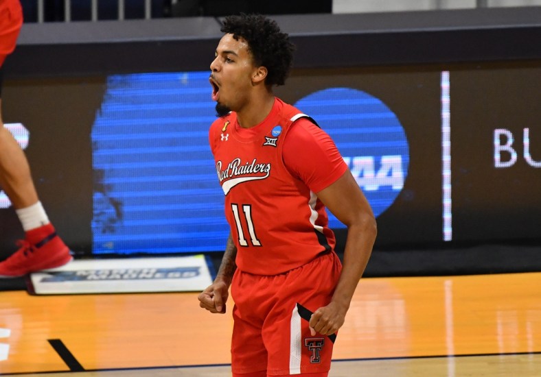 Mar 21, 2021; Indianapolis, Indiana, USA; Texas Tech Red Raiders guard Kyler Edwards (11) reacts after a three pointer in the first half against the Arkansas Razorbacks in the second round of the 2021 NCAA Tournament at Hinkle Fieldhouse. Mandatory Credit: Patrick Gorski-USA TODAY Sports
