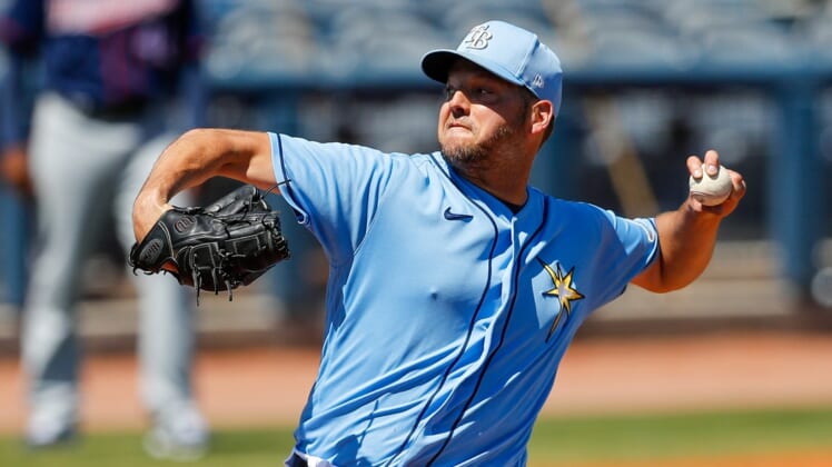 Mar 13, 2021; Port Charlotte, Florida, USA; Tampa Bay Rays starting pitcher Rich Hill (14) pitches the first inning  during spring training at Charlotte Sports Park. Mandatory Credit: Nathan Ray Seebeck-USA TODAY Sports
