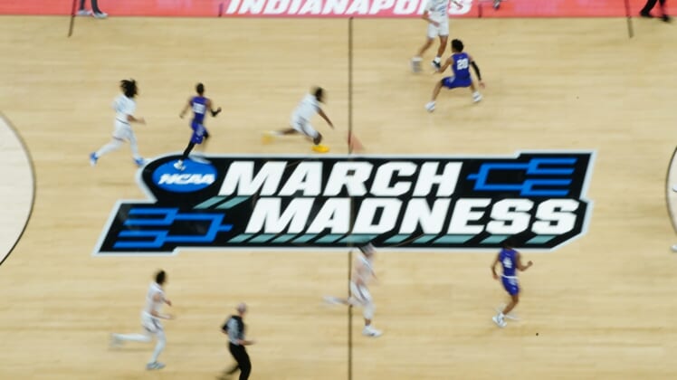 Mar 22, 2021; Indianapolis, Indiana, USA; General view of the March madness logo during the game between the UCLA Bruins and the Abilene Christian Wildcats in the second round of the 2021 NCAA Tournament at Bankers Life Fieldhouse. Mandatory Credit: Kirby Lee-USA TODAY Sports