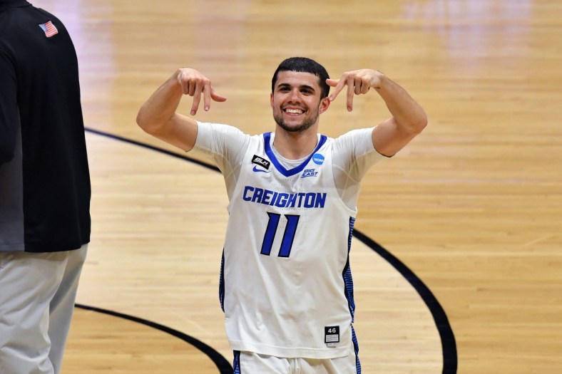 Mar 22, 2021; Indianapolis, Indiana, USA; Creighton Bluejays guard Marcus Zegarowski (11) celebrates after defeating the Ohio Bobcats in the second round of the 2021 NCAA Tournament at Hinkle Fieldhouse. Mandatory Credit: Patrick Gorski-USA TODAY Sports