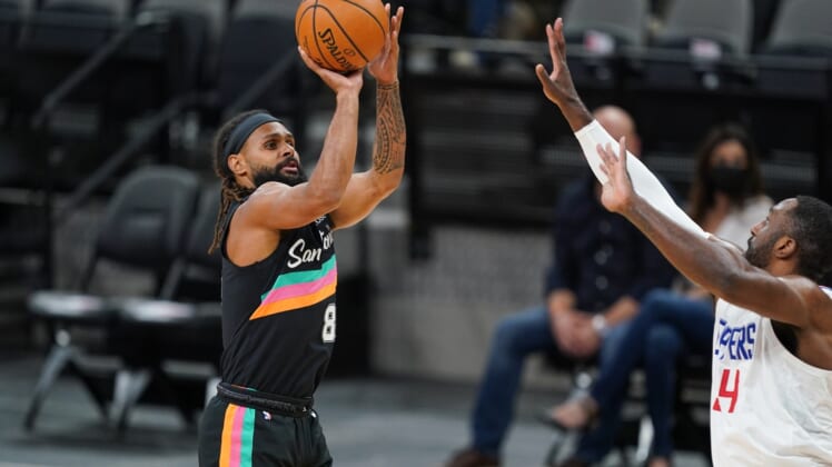 Mar 25, 2021; San Antonio, Texas, USA; San Antonio Spurs guard Patty Mills (8) shoots in the first half against the Los Angeles Clippers at the AT&T Center. Mandatory Credit: Daniel Dunn-USA TODAY Sports