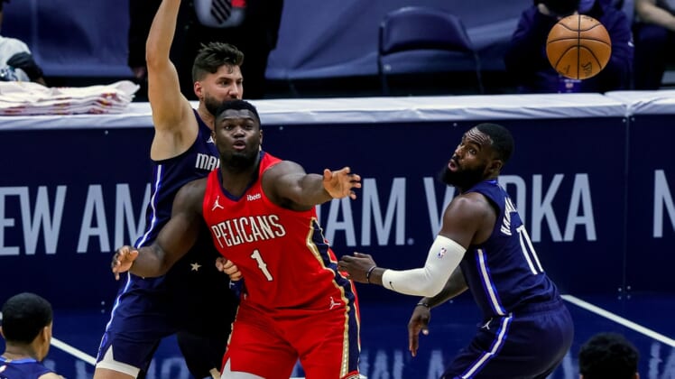Mar 27, 2021; New Orleans, Louisiana, USA;  Dallas Mavericks forward Tim Hardaway Jr. (11) knocks the ball loose from New Orleans Pelicans forward Zion Williamson (1) during the first half at the Smoothie King Center. Mandatory Credit: Stephen Lew-USA TODAY Sports