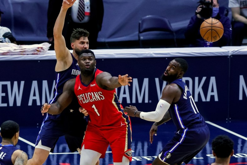 Mar 27, 2021; New Orleans, Louisiana, USA;  Dallas Mavericks forward Tim Hardaway Jr. (11) knocks the ball loose from New Orleans Pelicans forward Zion Williamson (1) during the first half at the Smoothie King Center. Mandatory Credit: Stephen Lew-USA TODAY Sports