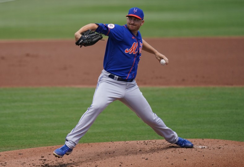 Mar 28, 2021; Jupiter, Florida, USA; New York Mets starting pitcher Mike Montgomery (70) delivers a pitch in the 1st inning of the spring training game against the Miami Marlins at Roger Dean Chevrolet Stadium. Mandatory Credit: Jasen Vinlove-USA TODAY Sports