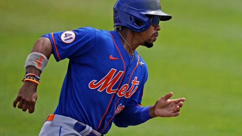 Mar 29, 2021; Jupiter, Florida, USA; New York Mets shortstop Francisco Lindor (12) rounds third base to score a run in the 1st inning of the spring training game against the St. Louis Cardinals at Roger Dean Chevrolet Stadium. Mandatory Credit: Jasen Vinlove-USA TODAY Sports