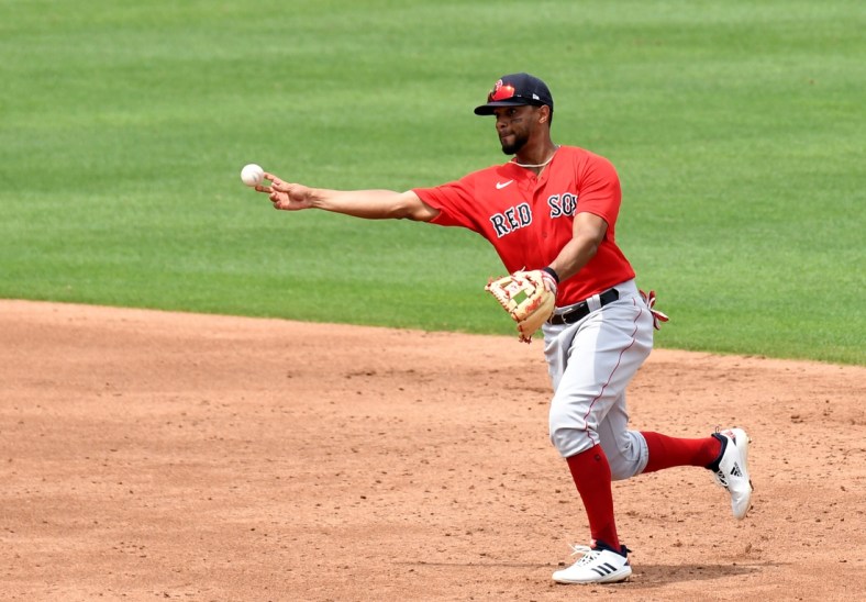 Mar 29, 2021; North Port, Florida, USA; Boston Red Sox infielder Xander Bogaerts (2) throws to first base in the third inning against the Atlanta Braves  during spring training at CoolToday Park. Mandatory Credit: Jonathan Dyer-USA TODAY Sports