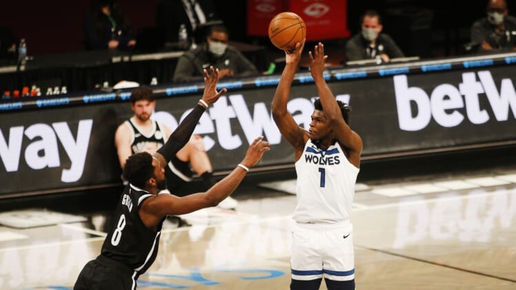 Mar 29, 2021; Brooklyn, New York, USA; Minnesota Timberwolves forward Anthony Edwards (1) shoots against Brooklyn Nets forward Jeff Green (8) during the second half at Barclays Center. Mandatory Credit: Andy Marlin-USA TODAY Sports