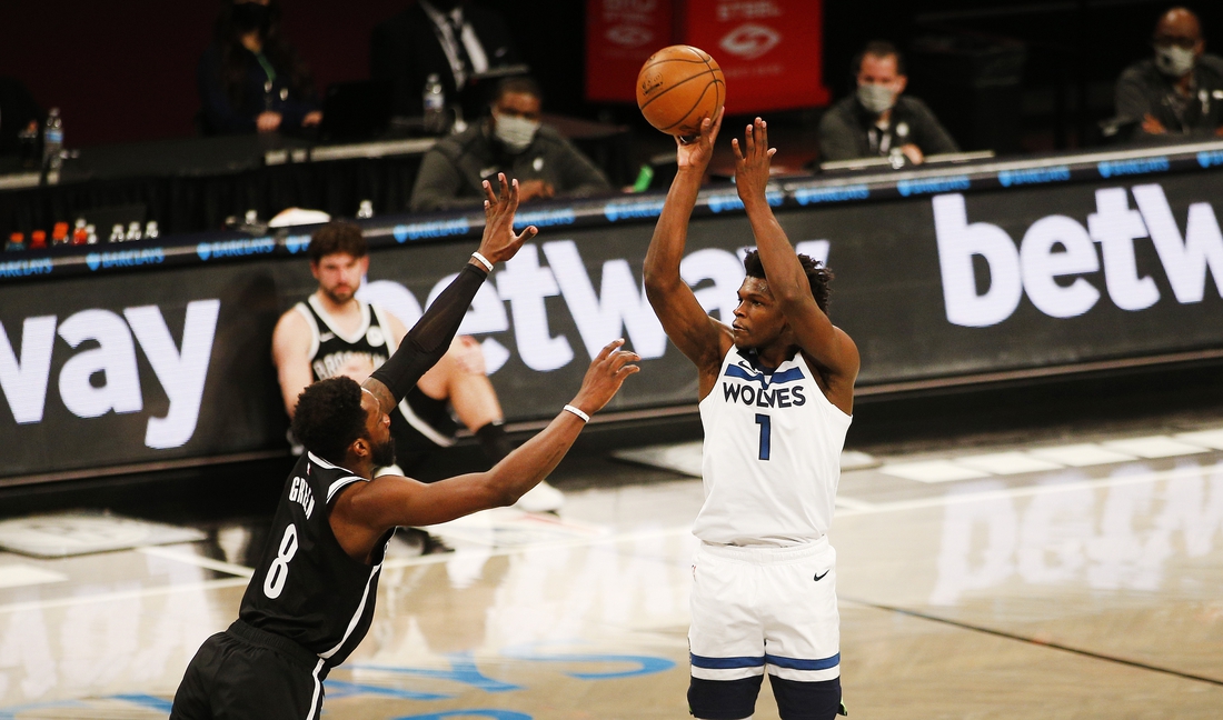 Mar 29, 2021; Brooklyn, New York, USA; Minnesota Timberwolves forward Anthony Edwards (1) shoots against Brooklyn Nets forward Jeff Green (8) during the second half at Barclays Center. Mandatory Credit: Andy Marlin-USA TODAY Sports