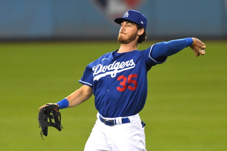Mar 29, 2021; Los Angeles, California, USA;  Los Angeles Dodgers center fielder Cody Bellinger (35) makes a throw after an out against the Los Angeles Angels in the fifth inning at Dodger Stadium. Mandatory Credit: Jayne Kamin-Oncea-USA TODAY Sports