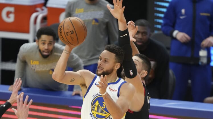 March 29, 2021; San Francisco, California, USA; Golden State Warriors guard Stephen Curry (30) shoots the basketball against Chicago Bulls center Nikola Vucevic (9) during the third quarter at Chase Center. Mandatory Credit: Kyle Terada-USA TODAY Sports