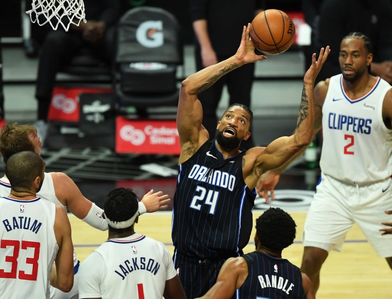 Mar 30, 2021; Los Angeles, California, USA; Orlando Magic center Khem Birch (24) grabs a rebound during the first half against the Los Angeles Clippers at Staples Center. Mandatory Credit: Jayne Kamin-Oncea-USA TODAY Sports