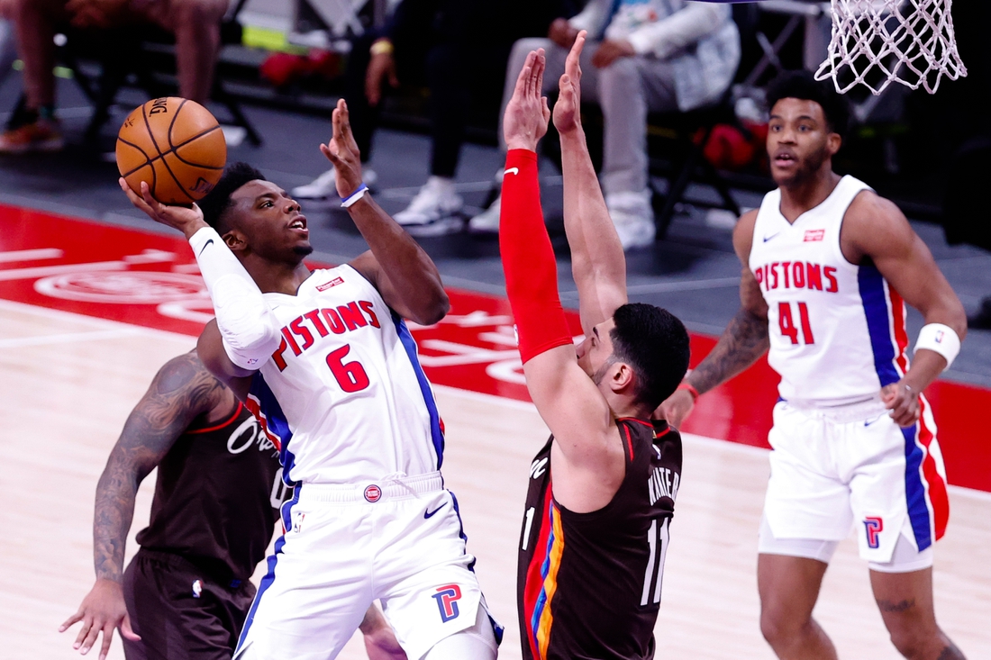 Mar 31, 2021; Detroit, Michigan, USA;  Detroit Pistons guard Hamidou Diallo (6) shoots on Portland Trail Blazers center Enes Kanter (11) in the first half at Little Caesars Arena. Mandatory Credit: Rick Osentoski-USA TODAY Sports