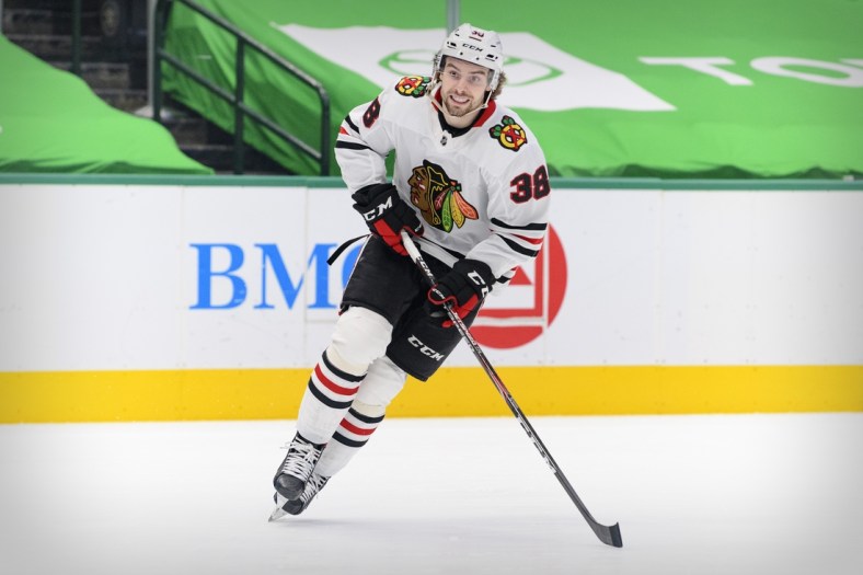 Mar 9, 2021; Dallas, Texas, USA; Chicago Blackhawks left wing Brandon Hagel (38) in action during the game between the Dallas Stars and the Chicago Blackhawks at the American Airlines Center. Mandatory Credit: Jerome Miron-USA TODAY Sports