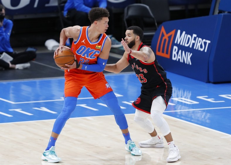 Mar 31, 2021; Oklahoma City, Oklahoma, USA; Oklahoma City Thunder center Isaiah Roby (22) is defended by Toronto Raptors guard Fred VanVleet (23) on a drive during the second half at Chesapeake Energy Arena. Mandatory Credit: Alonzo Adams-USA TODAY Sports