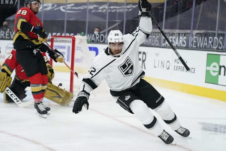 Mar 31, 2021; Las Vegas, Nevada, USA; Los Angeles Kings left wing Andreas Athanasiou (22) celebrates after scoring against the Vegas Golden Knights during the first period of an NHL hockey game at T-Mobile Arena. Mandatory Credit:  John Locher/POOL PHOTOS-USA TODAY Sports
