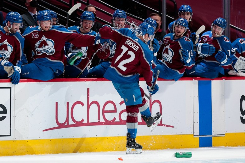 Mar 31, 2021; Denver, Colorado, USA; Colorado Avalanche right wing Joonas Donskoi (72) is doused with water after scoring a hat trick in the first period against the Arizona Coyotes at Ball Arena. Mandatory Credit: Isaiah J. Downing-USA TODAY Sports
