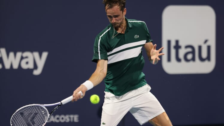 Mar 31, 2021; Miami, Florida, USA; Daniil Medvedev of Russia hits a forehand against Roberto Bautista Agut of Spain (not pictured) in a men's singles quarterfinal in the Miami Open at Hard Rock Stadium. Mandatory Credit: Geoff Burke-USA TODAY Sports