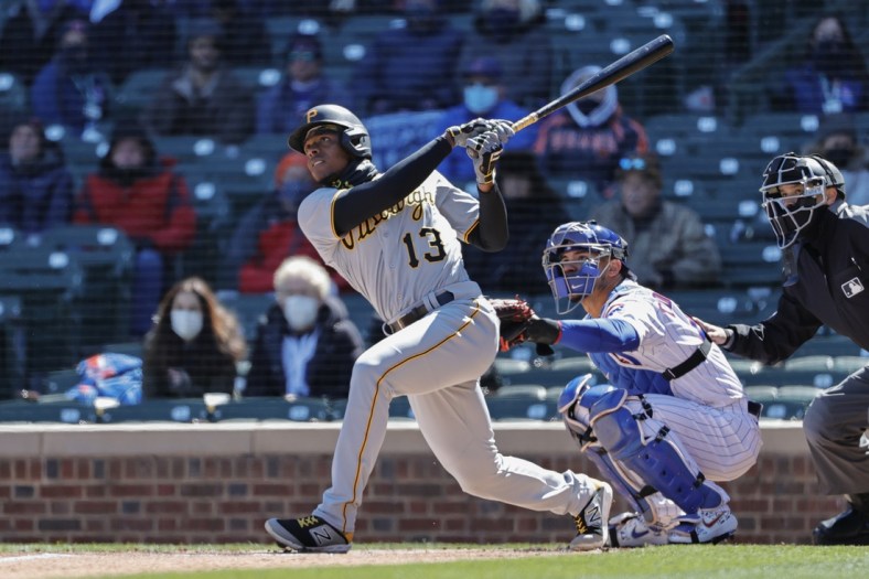 Apr 1, 2021; Chicago, Illinois, USA; Pittsburgh Pirates third baseman Ke'Bryan Hayes (13) hits a two-run home run against the Chicago Cubs in the first inning at Wrigley Field. Mandatory Credit: Kamil Krzaczynski-USA TODAY Sports