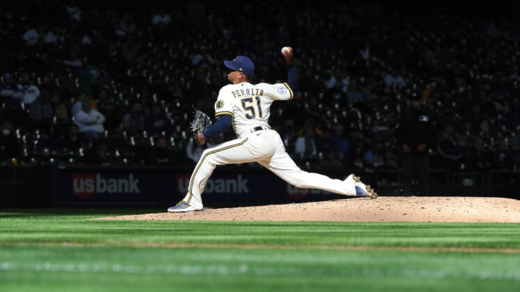 Apr 1, 2021; Milwaukee, Wisconsin, USA; Milwaukee Brewers relief pitcher Freddy Peralta (51) delivers a pitch against the Minnesota Twins in the sixth inning at American Family Field. Mandatory Credit: Michael McLoone-USA TODAY Sports