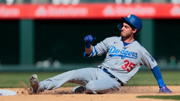 Apr 1, 2021; Denver, Colorado, USA; Los Angeles Dodgers center fielder Cody Bellinger (35) slides safely in to second on a double in the fifth inning against the Colorado Rockies at Coors Field. Mandatory Credit: Isaiah J. Downing-USA TODAY Sports