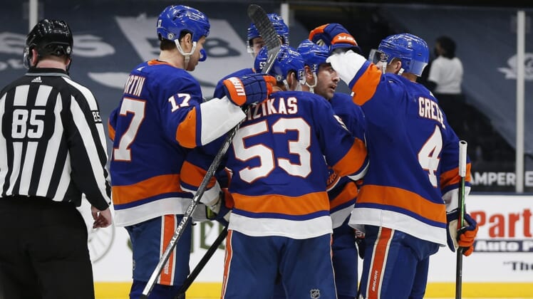 Apr 1, 2021; Uniondale, New York, USA; New York Islanders center Casey Cizikas (53) is congratulated after scoring a goal against the Washington Capitals during the second period at Nassau Veterans Memorial Coliseum. Mandatory Credit: Andy Marlin-USA TODAY Sports