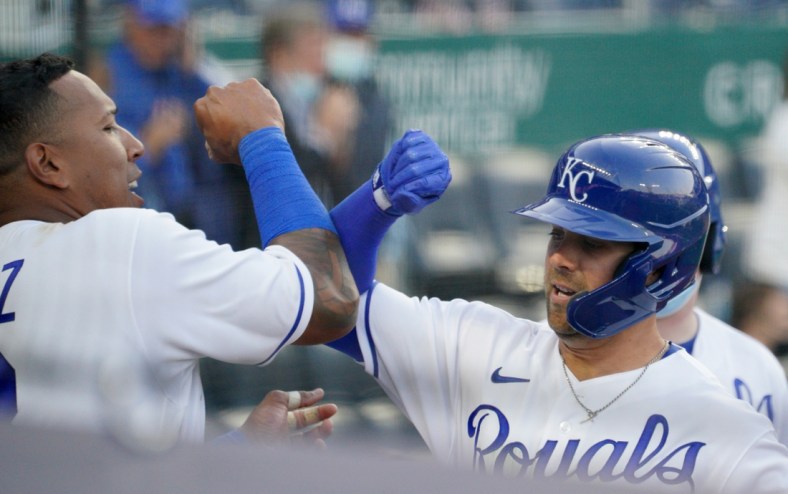 Apr 1, 2021; Kansas City, Missouri, USA; Kansas City Royals right fielder Whit Merrifield (15) celebrates with catcher Salvador Perez (13) after hitting a solo home run in the eighth inning against the Texas Rangers at Kauffman Stadium. Mandatory Credit: Denny Medley-USA TODAY Sports